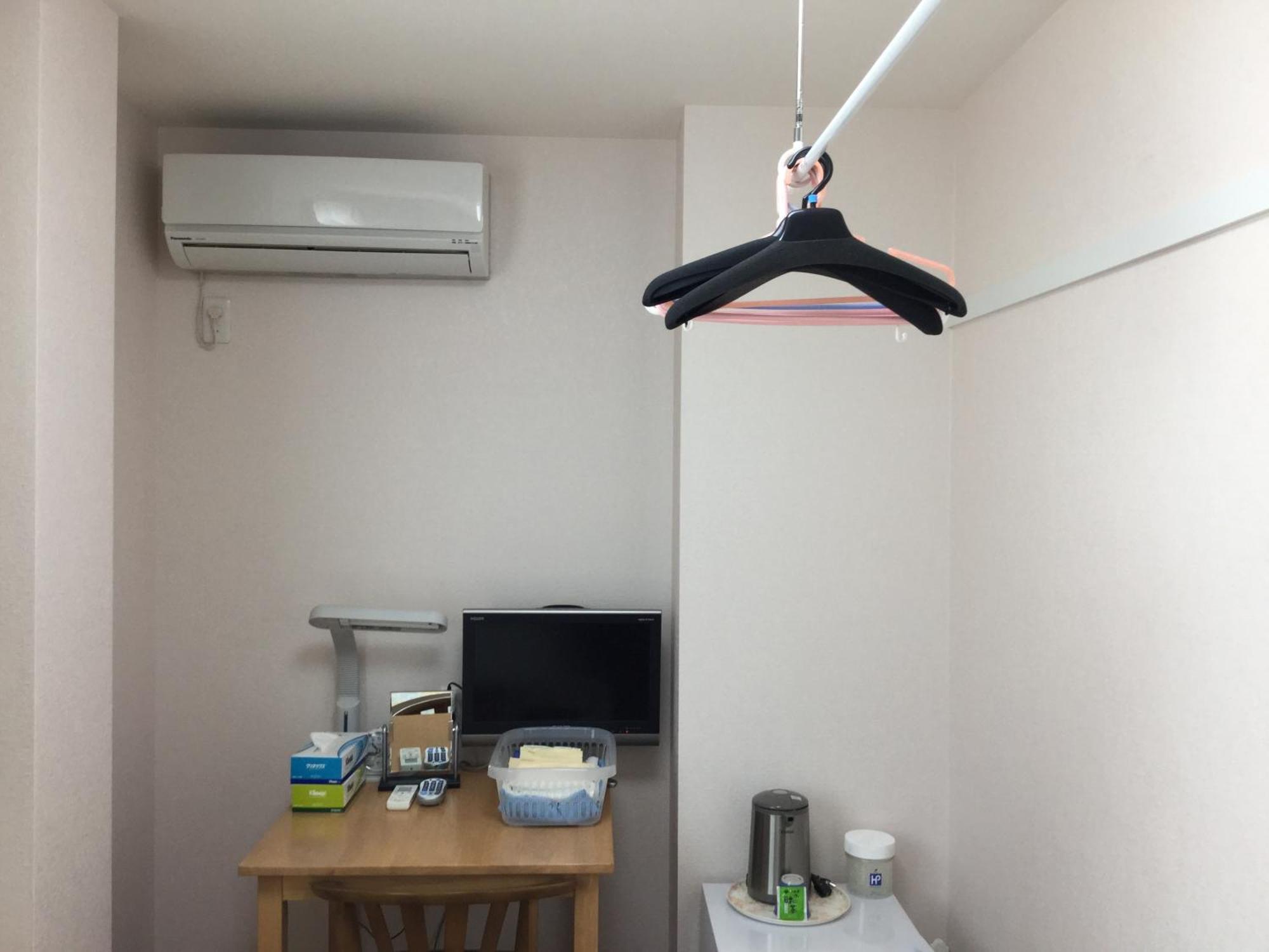 Business Inn Grandeur Fučú Pokoj fotografie